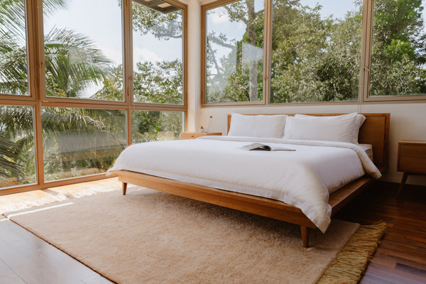 Minimalist bedroom with a wooden bed frame